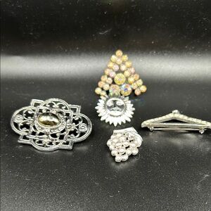 Set of vintage silver tone and rhinestone pins. Five total.